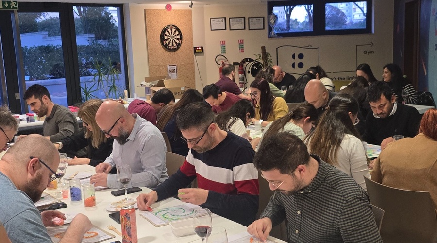 Team building group creating individual sections for a collaborative fused glass artwork